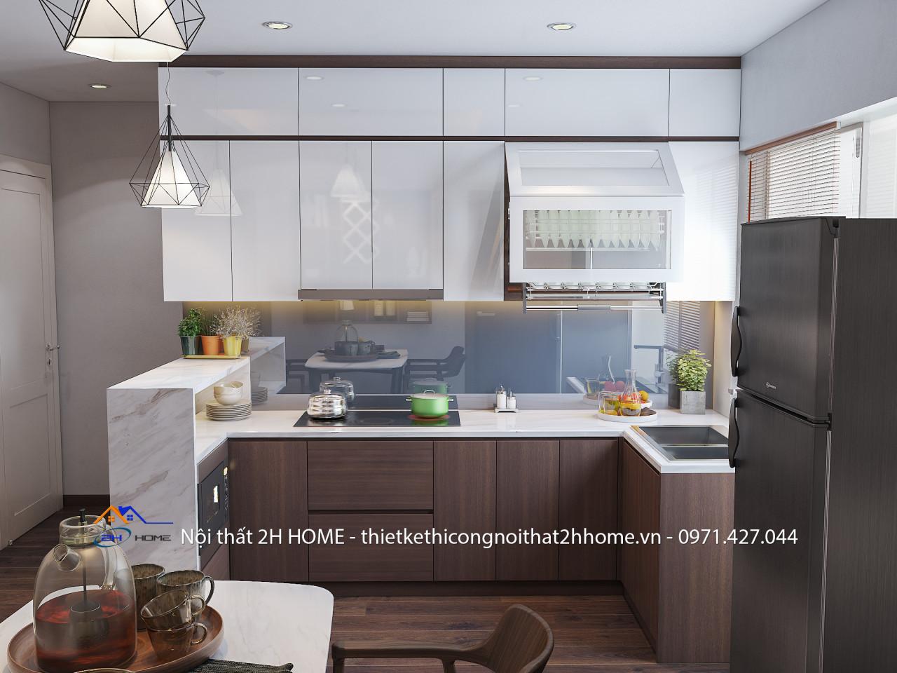 Tủ bếp được thiết kế với chất liệu acrylic tráng gương kết hợp với tông nâu gỗ mang lại cảm giác sạch sẽ và sang trọng